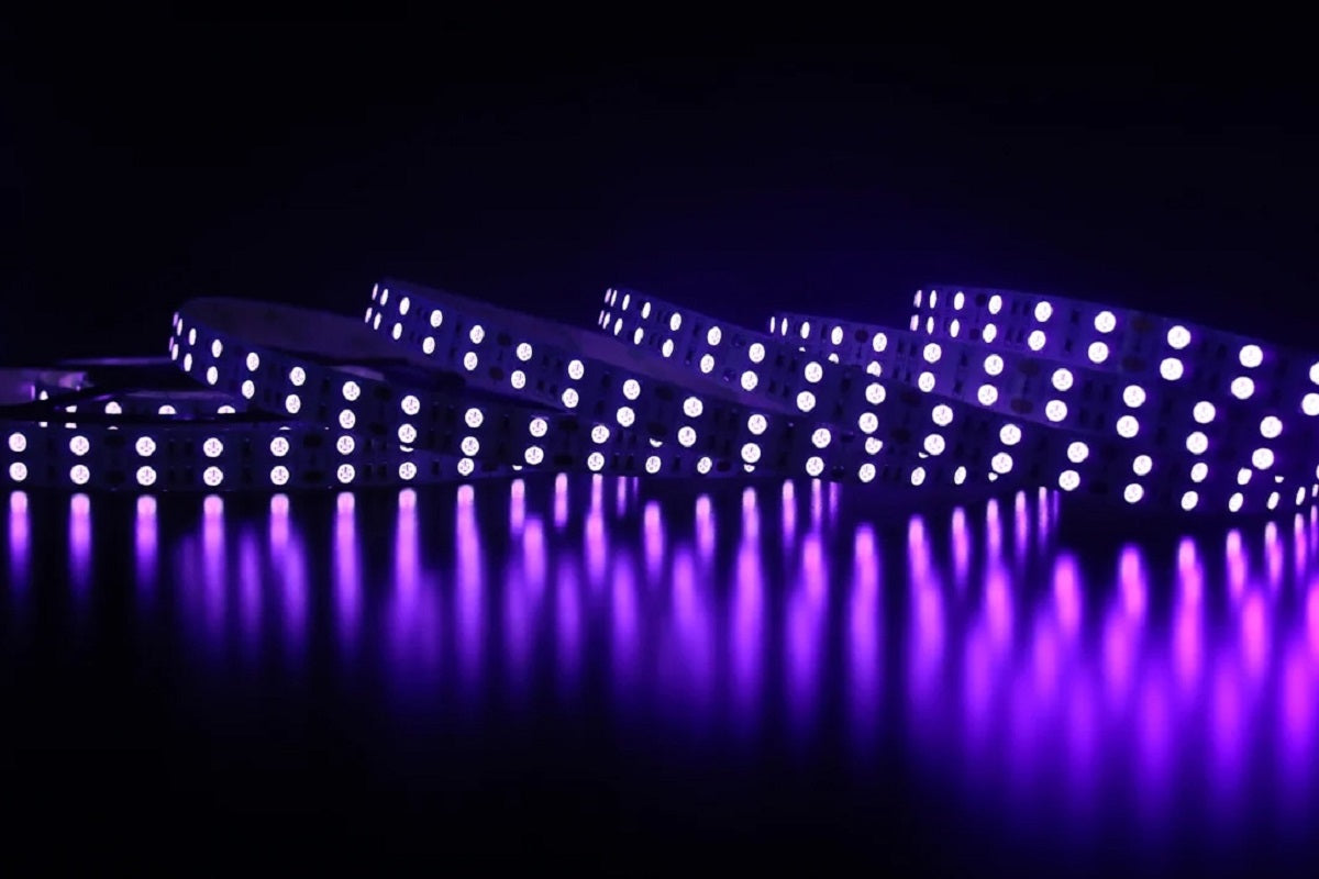 Illustrative LED strips glowing purple on a dark reflective surface.